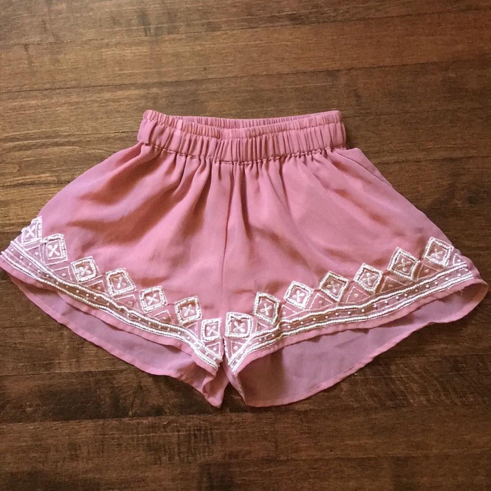 Fashion Web silky shorts with bead designs.